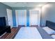 Bedroom showcasing the closet space, complemented by wood-look floors and natural light at 13116 Sheridan Dr, Hudson, FL 34667