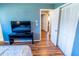 Bedroom with closet access, and a view into the house at 13116 Sheridan Dr, Hudson, FL 34667
