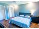 Spacious bedroom features a ceiling fan, closet, and a soothing blue color scheme at 13116 Sheridan Dr, Hudson, FL 34667