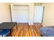 Open closet with ample storage space with a view to the bed and the rest of the room at 13116 Sheridan Dr, Hudson, FL 34667