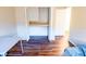 Bedroom featuring wood flooring, closet, and view into doorway at 13116 Sheridan Dr, Hudson, FL 34667