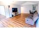 Cozy living room featuring wood floors, vaulted ceilings and entertainment area with comfortable seating at 13116 Sheridan Dr, Hudson, FL 34667