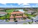 Beautiful condo community with lush landscaping, serene lake, and manicured golf course views at 13823 Messina Loop # 204, Bradenton, FL 34211