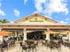 Outdoor Bahama Bar offers a relaxing spot with tables, chairs and umbrellas to enjoy the community at 13823 Messina Loop # 204, Bradenton, FL 34211