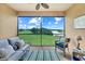 Relaxing balcony with comfortable seating and scenic views of the surrounding landscape and water at 13823 Messina Loop # 204, Bradenton, FL 34211