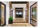 Inviting hall with stone accents leads to Barrel House Bistro, featuring tiled floors and bright lighting at 13823 Messina Loop # 204, Bradenton, FL 34211