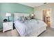 Comfortable bedroom with a king-size bed, neutral tones, and an ensuite bathroom at 13823 Messina Loop # 204, Bradenton, FL 34211