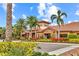 Beautiful clubhouse with lush landscaping, showcasing a welcoming entrance and attractive architectural details at 13823 Messina Loop # 204, Bradenton, FL 34211