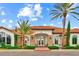 Elegant clubhouse featuring a terracotta tile roof, stone accents, and meticulously landscaped grounds at 13823 Messina Loop # 204, Bradenton, FL 34211