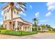 The Esplanade Golf & Country Club entrance has stone accents, lush landscaping, and a gated entry at 13823 Messina Loop # 204, Bradenton, FL 34211