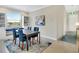 Bright dining room with a window seat, built-in shelving, and elegant decor at 13823 Messina Loop # 204, Bradenton, FL 34211