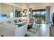 Inviting living room with neutral tones, stylish furniture, and large windows offering ample natural light at 13823 Messina Loop # 204, Bradenton, FL 34211