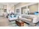 Open living space with neutral tones, comfortable seating, and views into the kitchen at 13823 Messina Loop # 204, Bradenton, FL 34211