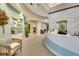 Inviting lobby features curved architecture, a reception desk, comfortable seating, and elegant decor at 13823 Messina Loop # 204, Bradenton, FL 34211