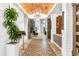 Stunning lobby featuring a decorative brick ceiling, tiled floors, elegant light fixtures, and ample seating at 13823 Messina Loop # 204, Bradenton, FL 34211