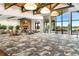 Spacious meeting room with modern decor, floor-to-ceiling windows, and comfortable seating arrangements for gatherings at 13823 Messina Loop # 204, Bradenton, FL 34211