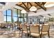 Well-lit meeting room showcasing comfortable seating, floor-to-ceiling windows, and elegant decor for various events at 13823 Messina Loop # 204, Bradenton, FL 34211