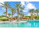 Resort-style pool with luxurious cabanas and lounge chairs, surrounded by lush palm trees for ultimate relaxation at 13823 Messina Loop # 204, Bradenton, FL 34211