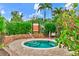 Relaxing community spa surrounded by lush greenery, offering a tranquil escape with 'Spa Rules' posted at 13823 Messina Loop # 204, Bradenton, FL 34211