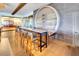 Tap Room with bar table and view into the club area with multiple seating options at 13823 Messina Loop # 204, Bradenton, FL 34211
