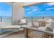 Relaxing balcony with comfortable seating, perfect for enjoying ocean views at 1390 Gulf Blvd # Ph 2, Clearwater Beach, FL 33767