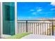 Balcony view of sandy beach with ocean view in the distance at 1390 Gulf Blvd # Ph 2, Clearwater Beach, FL 33767