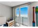 Bedroom view of the beach and ocean through sliding glass doors to balcony at 1390 Gulf Blvd # Ph 2, Clearwater Beach, FL 33767