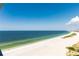 Panoramic view of a stunning white sand beach with clear turquoise water at 1390 Gulf Blvd # Ph 2, Clearwater Beach, FL 33767