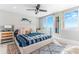Serene bedroom with ocean view, nautical accents, and a comfortable king bed with stylish bedding at 1390 Gulf Blvd # Ph 2, Clearwater Beach, FL 33767