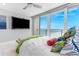 This bedroom features sliding glass doors leading to a private balcony with views overlooking the ocean at 1390 Gulf Blvd # Ph 2, Clearwater Beach, FL 33767