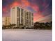 Expansive beachfront condo featuring beautiful views and palm tree landscaping at 1390 Gulf Blvd # Ph 2, Clearwater Beach, FL 33767