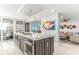 Modern kitchen featuring a large island with stainless steel appliances and pendant lighting at 1390 Gulf Blvd # Ph 2, Clearwater Beach, FL 33767