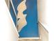 View up stairway with custom blue wall art and modern design features at 1390 Gulf Blvd # Ph 2, Clearwater Beach, FL 33767