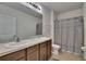 Bathroom features a double sink vanity with a shower and bathtub combination at 14153 Arbor Pines Dr, Riverview, FL 33579