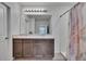 Bathroom featuring a double sink vanity and a separate shower area at 14153 Arbor Pines Dr, Riverview, FL 33579