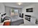 Bedroom with natural light, gray furnishings, and plush carpet flooring at 14153 Arbor Pines Dr, Riverview, FL 33579