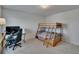 Neutral bedroom with a bunk bed and desk, perfect for a ' room or guest room at 14153 Arbor Pines Dr, Riverview, FL 33579
