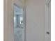 Open doorway to bedroom featuring carpet flooring and natural light at 14153 Arbor Pines Dr, Riverview, FL 33579