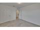A clean and bright bedroom with neutral carpet and white trim offers a blank canvas at 14153 Arbor Pines Dr, Riverview, FL 33579