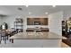 Well-lit kitchen features an island, stainless steel appliances, and ample cabinet space at 14153 Arbor Pines Dr, Riverview, FL 33579