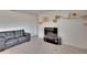 Bright living room features a comfortable sofa and cat enrichment wall at 14153 Arbor Pines Dr, Riverview, FL 33579