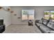 Bright living room with cat enrichment wall and access to the backyard at 14153 Arbor Pines Dr, Riverview, FL 33579