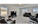 Spacious living room with plush carpeting, plenty of natural light and comfortable seating at 14153 Arbor Pines Dr, Riverview, FL 33579
