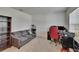 Neutral colored home office with a grey sofa, large window, and modern furnishings at 14153 Arbor Pines Dr, Riverview, FL 33579