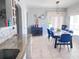Spacious dining room with a large table and granite countertops visible in the adjoining kitchen at 16313 Bridgecrossing Dr, Lithia, FL 33547