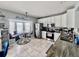 Bright kitchen with white cabinets, stainless steel appliances, and a cozy breakfast nook overlooking the water at 16313 Bridgecrossing Dr, Lithia, FL 33547