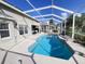 Inviting in-ground pool surrounded by a screened enclosure and a well-maintained backyard at 16313 Bridgecrossing Dr, Lithia, FL 33547