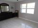 Bedroom with furniture and tile floors with a window at 1660 Caledonia Dr, Palm Harbor, FL 34684