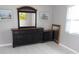 A bedroom featuring a matching dark dresser with a mirror and bedside table at 1660 Caledonia Dr, Palm Harbor, FL 34684