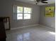 Bedroom with a window overlooking a green lawn at 1660 Caledonia Dr, Palm Harbor, FL 34684